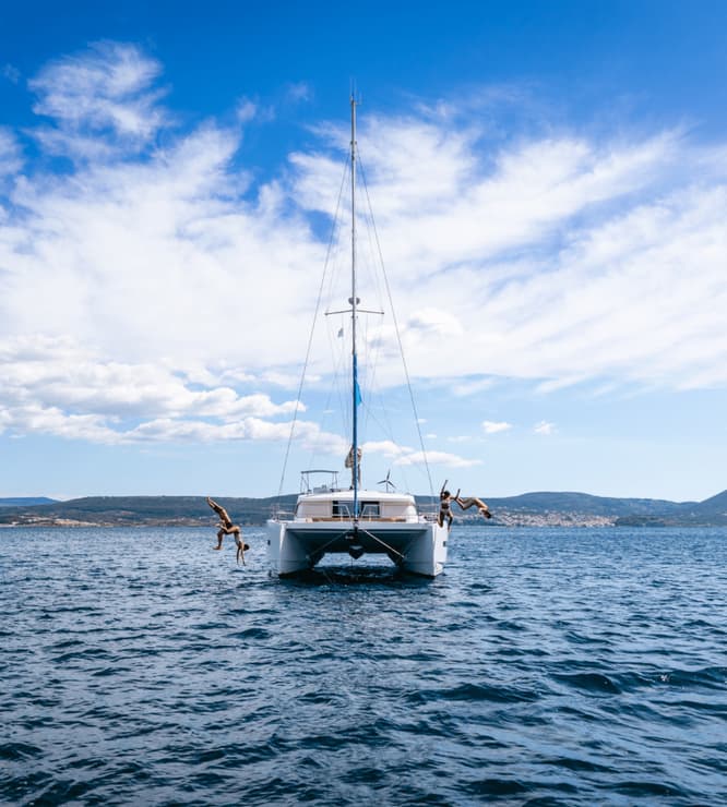 A group of people enjoying a sunny day on a yacht
